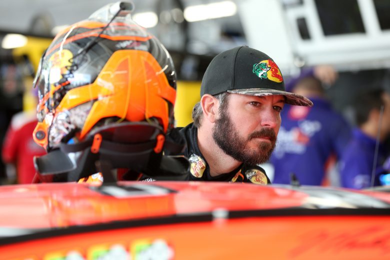 DOVER, DELAWARE - OCTOBER 04: Martin Truex Jr., driver of the #19 Bass Pro Shops Toyota, stands by his car during practice for the Monster Energy NASCAR Cup Series Drydene 400 at Dover International Speedway on October 04, 2019 in Dover, Delaware. (Photo by Matt Sullivan/Getty Images) | Getty Images