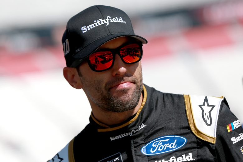 BRISTOL, TENNESSEE - AUGUST 16: Aric Almirola, driver of the #10 Smithfield Ford, stands in the garage during practice for the Monster Energy NASCAR Cup Series Bass Pro Shops NRA Night Race at Bristol Motor Speedway on August 16, 2019 in Bristol, Tennessee. (Photo by Sean Gardner/Getty Images) | Getty Images