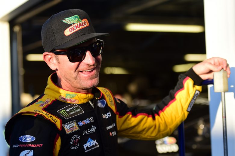 KANSAS CITY, KANSAS - OCTOBER 18: Clint Bowyer, driver of the #14 DEKALB Ford, stands in the garage area during practice for the Monster Energy NASCAR Cup Series Hollywood Casino 400 at Kansas Speedway on October 18, 2019 in Kansas City, Kansas. (Photo by Jared C. Tilton/Getty Images) | Getty Images