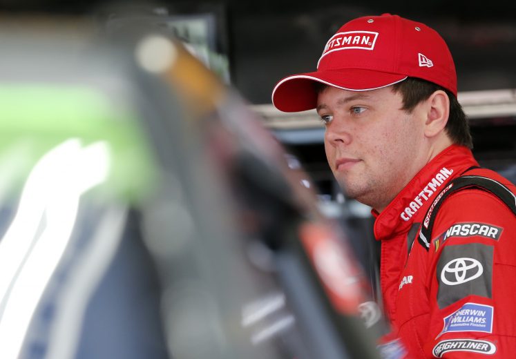 CHARLOTTE, NORTH CAROLINA - SEPTEMBER 28: Erik Jones, driver of the #20 Craftsman Toyota, stands in the garage area during practice for the Monster Energy NASCAR Cup Series Bank of America ROVAL 400 at Charlotte Motor Speedway on September 28, 2019 in Charlotte, North Carolina. (Photo by Brian Lawdermilk/Getty Images) | Getty Images