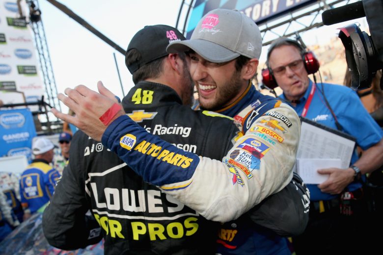DOVER, DE - OCTOBER 07:  Chase Elliott, driver of the #9 NAPA Auto Parts Chevrolet, is congratulated by Jimmie Johnson, driver of the #48 Lowe's for Pros Chevrolet, in Victory Lane after winning the Monster Energy NASCAR Cup Series Gander Outdoors 400 at Dover International Speedway on October 7, 2018 in Dover, Delaware.  (Photo by Brian Lawdermilk/Getty Images) | Getty Images