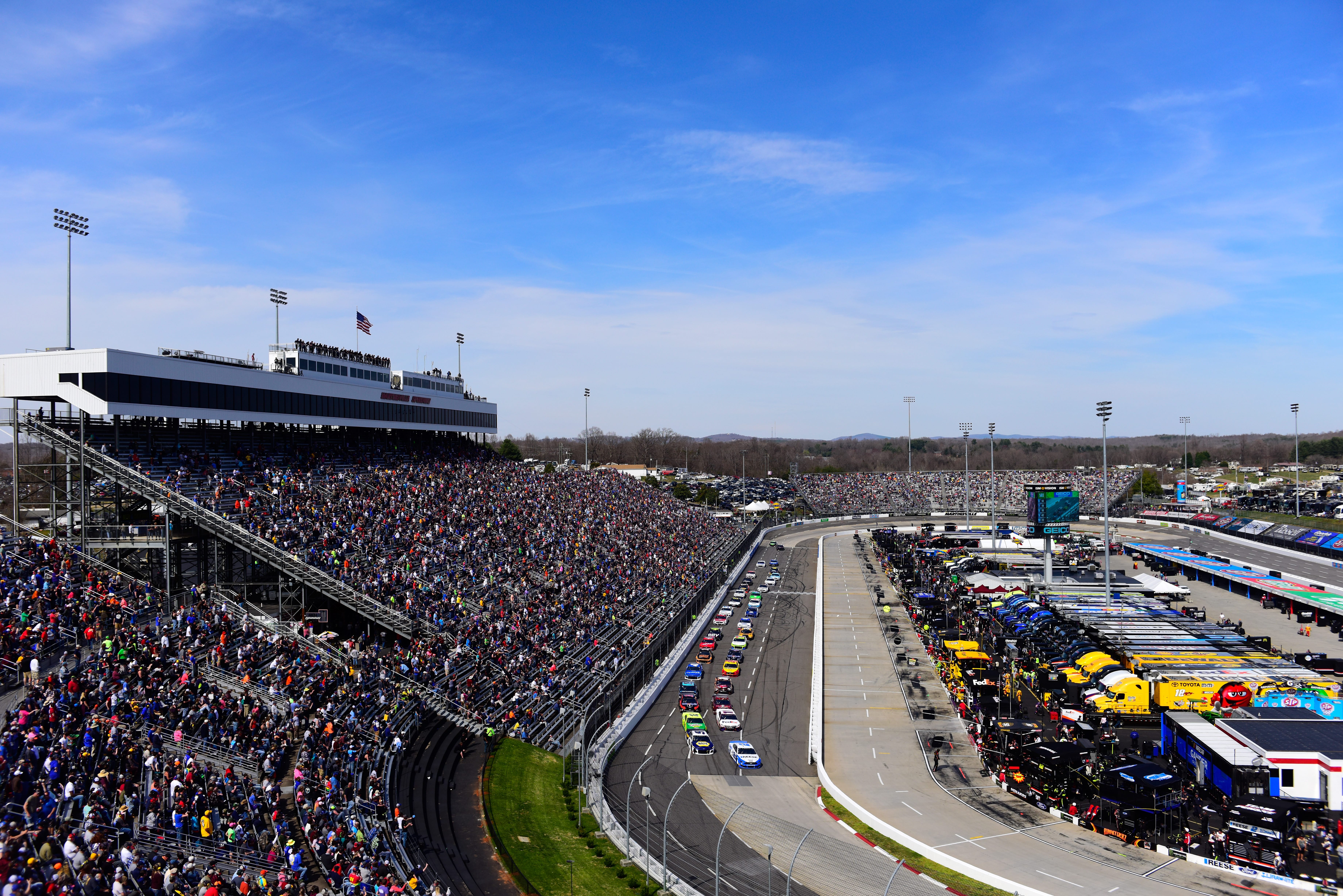 MARTINSVILLE, VA - MARCH 24:  Brad Keselowski, driver of the #2 Reese/Draw Tite Ford, and Chase Elliott, driver of the #9 NAPA Auto Parts Chevrolet, lead the field during the Monster Energy NASCAR Cup Series STP 500 at Martinsville Speedway on March 24, 2019 in Martinsville, Virginia.  (Photo by Jared C. Tilton/Getty Images) | Getty Images