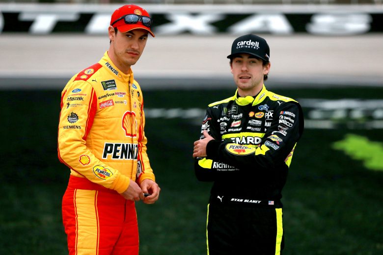 FORT WORTH, TX - MARCH 29:  Joey Logano, driver of the #22 Shell Pennzoil Ford, and Ryan Blaney, driver of the #12 Menards/Cardell Cabinetry Ford, stand on the grid during qualifying for the Monster Energy NASCAR Cup Series O'Reilly Auto Parts 500 at Texas Motor Speedway on March 29, 2019 in Fort Worth, Texas.  (Photo by Sean Gardner/Getty Images) | Getty Images