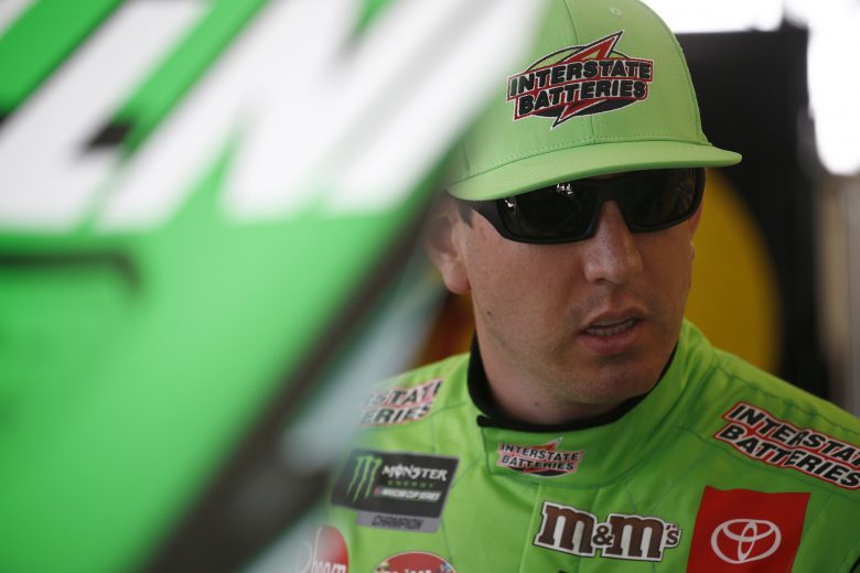 DOVER, DELAWARE - OCTOBER 04: Kyle Busch, driver of the #18 Interstate Batteries Toyota, stands by his car during practice for the Monster Energy NASCAR Cup Series Drydene 400 at Dover International Speedway on October 04, 2019 in Dover, Delaware. (Photo by Jeff Zelevansky/Getty Images)