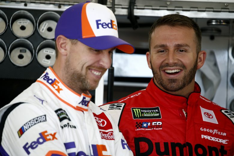 DOVER, DELAWARE - OCTOBER 04: Denny Hamlin, driver of the #11 FedEx Express Toyota, talks with Matt DiBenedetto, driver of the #95 Dumont Jets Toyota, during practice for the Monster Energy NASCAR Cup Series Drydene 400 at Dover International Speedway on October 04, 2019 in Dover, Delaware. (Photo by Jeff Zelevansky/Getty Images)