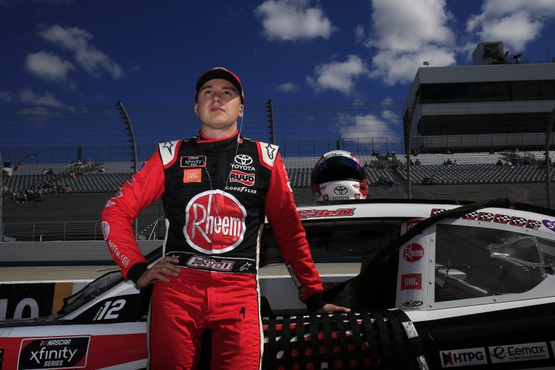 DOVER, DELAWARE - OCTOBER 05: Christopher Bell, driver of the #20 Rheem Toyota, stands on the grid during qualifying for the NASCAR Xfinity Series Use Your Melon Drive Sober 200 at Dover International Speedway on October 05, 2019 in Dover, Delaware. (Photo by Chris Trotman/Getty Images) | Getty Images