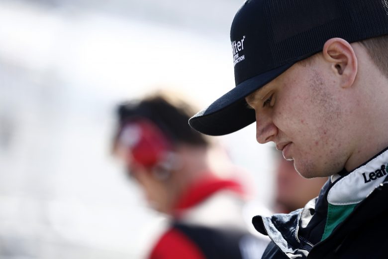 DOVER, DELAWARE - OCTOBER 05: Justin Haley, driver of the #11 LeafFilter Gutter Protection Chevrolet, stands on the grid during qualifying for the NASCAR Xfinity Series Use Your Melon Drive Sober 200 at Dover International Speedway on October 05, 2019 in Dover, Delaware. (Photo by Jeff Zelevansky/Getty Images)