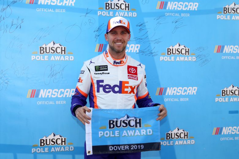 DOVER, DELAWARE - OCTOBER 05: Denny Hamlin, driver of the #11 FedEx Express Toyota, poses with the pole award after qualifying for the Monster Energy NASCAR Cup Series Drydene 400 at Dover International Speedway on October 05, 2019 in Dover, Delaware. (Photo by Matt Sullivan/Getty Images) | Getty Images