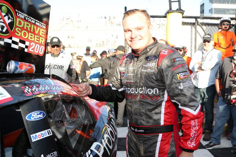 DOVER, DELAWARE - OCTOBER 05: Cole Custer, driver of the #00 Production Alliance Group Ford, applies the winner's sticker in Victory Lane after winning the NASCAR Xfinity Series Use Your Melon Drive Sober 200 at Dover International Speedway on October 05, 2019 in Dover, Delaware. (Photo by Matt Sullivan/Getty Images) | Getty Images