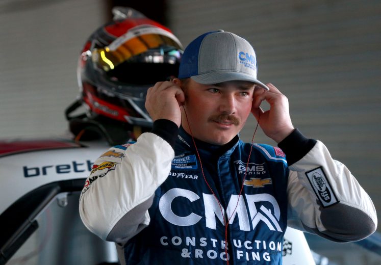 TALLADEGA, ALABAMA - OCTOBER 11: Brett Moffitt, driver of the #24 CMR Construction & Roofing Chevrolet, stands in the garage area during practice for the NASCAR Gander Outdoor Truck Series Sugarlands Shine 250 at Talladega Superspeedway on October 11, 2019 in Talladega, Alabama. (Photo by Sean Gardner/Getty Images) | Getty Images