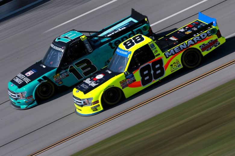 TALLADEGA, ALABAMA - OCTOBER 11: Matt Crafton, driver of the #88 Black Label Bacon/Menards Ford, and Johnny Sauter, driver of the #13 Tenda Heal Ford, practice for the NASCAR Gander Outdoor Truck Series Sugarlands Shine 250 at Talladega Superspeedway on October 11, 2019 in Talladega, Alabama. (Photo by Sean Gardner/Getty Images) | Getty Images