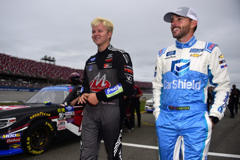 TALLADEGA, ALABAMA - OCTOBER 12: Tyler Ankrum, driver of the #17 May's Hawaii/Modern Meat Co Toyota, speaks with Ross Chastain, driver of the #45 CarShield Chevrolet, on the grid during qualifying for the NASCAR Gander Outdoor Truck Series Sugarlands Shine 250 at Talladega Superspeedway on October 12, 2019 in Talladega, Alabama. (Photo by Jared C. Tilton/Getty Images) | Getty Images