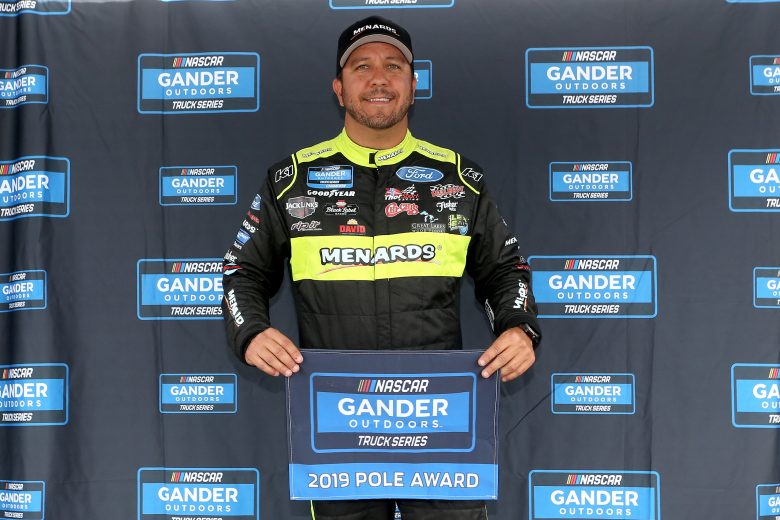 TALLADEGA, ALABAMA - OCTOBER 12: Matt Crafton, driver of the #88 Black Label Bacon/Menards Ford, poses with the Pole Award after posting the quickest lap during qualifying for the NASCAR Gander Outdoor Truck Series Sugarlands Shine 250 at Talladega Superspeedway on October 12, 2019 in Talladega, Alabama. (Photo by Brian Lawdermilk/Getty Images) | Getty Images