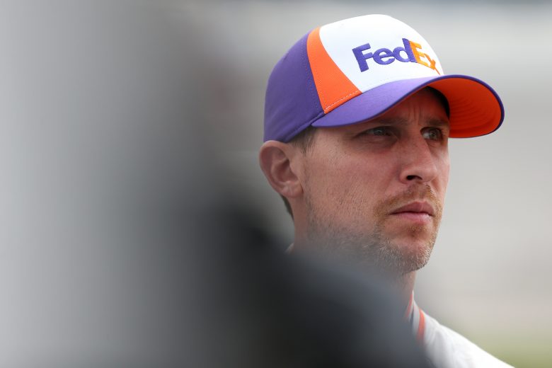 TALLADEGA, ALABAMA - OCTOBER 12: Denny Hamlin, driver of the #11 FedEx Ground Toyota, stands on the grid during qualifying for the Monster Energy NASCAR Cup Series 1000Bulbs.com 500 at Talladega Superspeedway on October 12, 2019 in Talladega, Alabama. (Photo by Brian Lawdermilk/Getty Images) | Getty Images