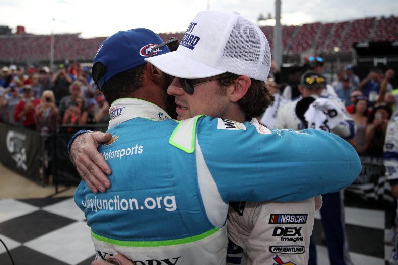 TALLADEGA, ALABAMA - OCTOBER 14: Ryan Blaney, driver of the #12 Dent Wizard Ford, is congratulated after winning by Bubba Wallace, driver of the #43 Victory Junction Chevrolet, during the Monster Energy NASCAR Cup Series 1000Bulbs.com 500 at Talladega Superspeedway on October 14, 2019 in Talladega, Alabama. (Photo by Chris Graythen/Getty Images) | Getty Images