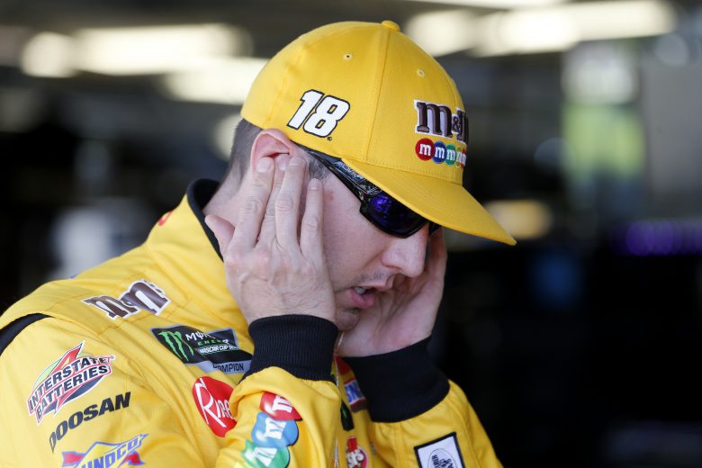 KANSAS CITY, KANSAS - OCTOBER 18: Kyle Busch, driver of the #18 M&M's Halloween Toyota, stands in the garage area during practice for the Monster Energy NASCAR Cup Series Hollywood Casino 400 at Kansas Speedway on October 18, 2019 in Kansas City, Kansas. (Photo by Brian Lawdermilk/Getty Images) | Getty Images