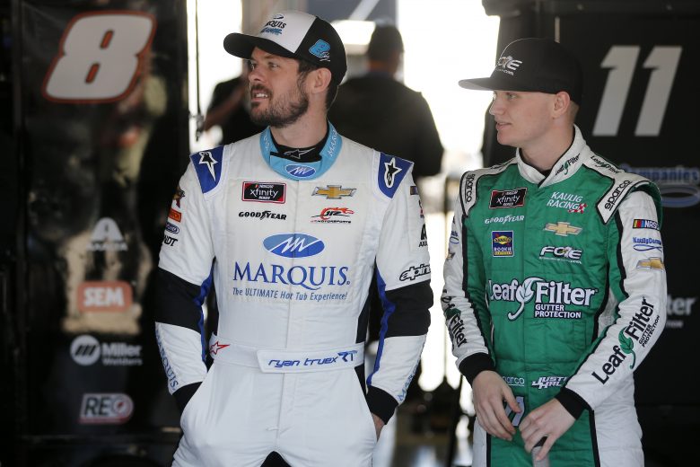 KANSAS CITY, KANSAS - OCTOBER 18: Ryan Truex, driver of the #8 Marquis Chevrolet, and Justin Haley, driver of the #11 LeafFilter Gutter Protection Chevrolet, look on during practice for the NASCAR Xfinity Series Kansas Lottery 300 at Kansas Speedway on October 18, 2019 in Kansas City, Kansas. (Photo by Brian Lawdermilk/Getty Images) | Getty Images