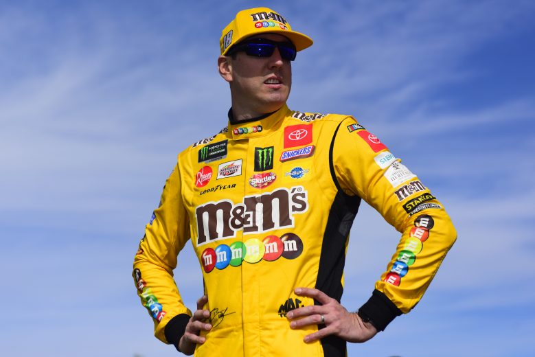 KANSAS CITY, KANSAS - OCTOBER 20: Kyle Busch, driver of the #18 M&M's Halloween Toyota, stands on the grid prior to the Monster Energy NASCAR Cup Series Hollywood Casino 400 at Kansas Speedway on October 20, 2019 in Kansas City, Kansas. (Photo by Jared C. Tilton/Getty Images) | Getty Images
