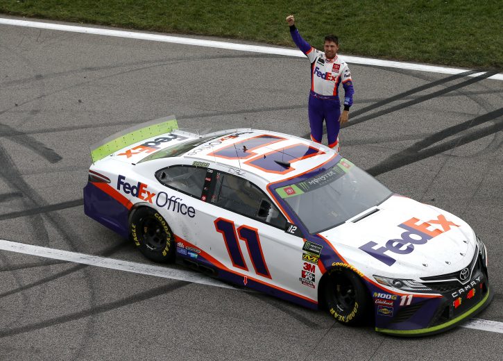 KANSAS CITY, KANSAS - OCTOBER 20: Denny Hamlin, driver of the #11 FedEx Office Toyota, celebrates his victory after the Monster Energy NASCAR Cup Series Hollywood Casino 400 at Kansas Speedway on October 20, 2019 in Kansas City, Kansas. (Photo by Jonathan Ferrey/Getty Images) | Getty Images