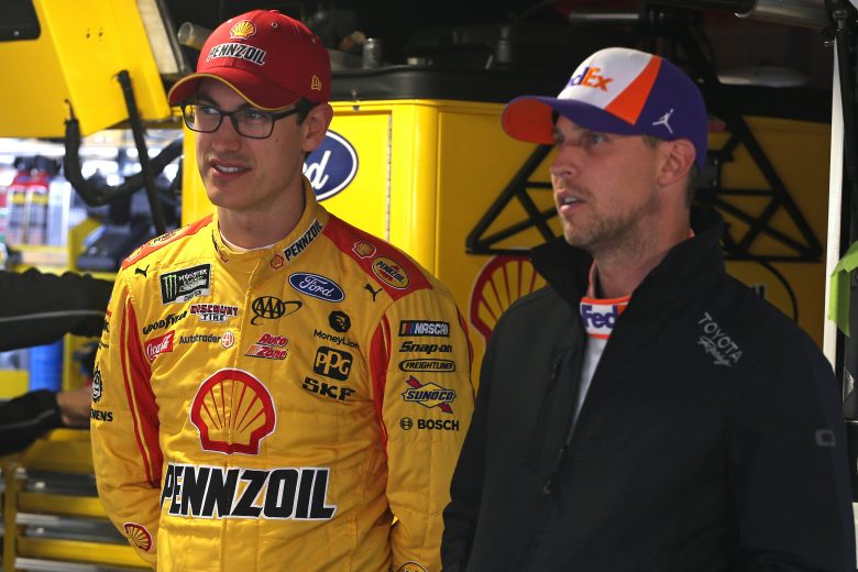 MARTINSVILLE, VIRGINIA - OCTOBER 26: Joey Logano, driver of the #22 Shell Pennzoil Ford, talks with Denny Hamlin, driver of the #11 FedEx Freight Toyota, during practice for the Monster Energy NASCAR Cup Series First Data 500 at Martinsville Speedway on October 26, 2019 in Martinsville, Virginia. (Photo by Matt Sullivan/Getty Images) | Getty Images