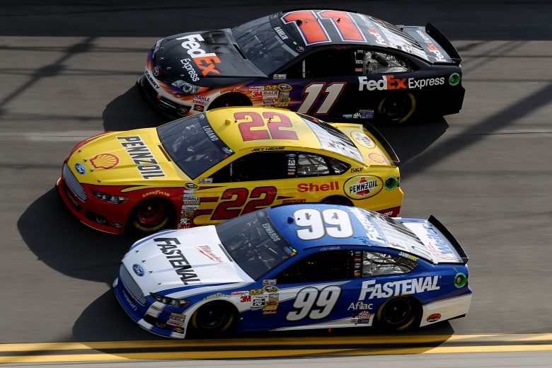 DAYTONA BEACH, FL - FEBRUARY 21: Denny Hamlin, driver of the #11 FedEx Express Toyota, Joey Logano, driver of the #22 Shell-Pennzoil/AAA Ford, and Carl Edwards, driver of the #99 Fastenal Ford, compete during the NASCAR Sprint Cup Series Budweiser Duel 1 at Daytona International Speedway on February 21, 2013 in Daytona Beach, Florida. (Photo by Todd Warshaw/Getty Images) | Getty Images