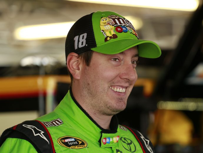 KANSAS CITY, KS - OCTOBER 16:  Kyle Busch, driver of the #18 M&M's Halloween Toyota, stands in the garage area during practice for the NASCAR Sprint Cup Series Hollywood Casino 400 at Kansas Speedway on October 16, 2015 in Kansas City, Kansas.  (Photo by Matt Sullivan/Getty Images) | Getty Images