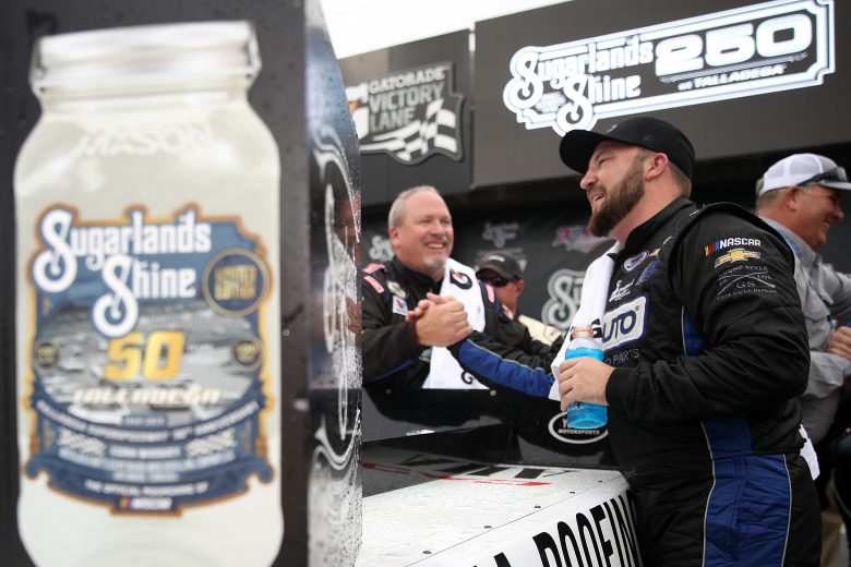 TALLADEGA, ALABAMA - OCTOBER 12: Spencer Boyd, driver of the #20 Alabama Roofing Professionals Chevrolet, celebrates in victory lane after winning the NASCAR Gander Outdoor Truck Series Sugarlands Shine 250 at Talladega Superspeedway on October 12, 2019 in Talladega, Alabama. (Photo by Chris Graythen/Getty Images) | Getty Images