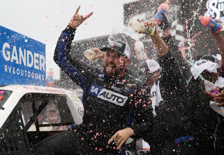 TALLADEGA, ALABAMA - OCTOBER 12: Spencer Boyd, driver of the #20 Alabama Roofing Professionals Chevrolet, celebrates in victory lane after winning the NASCAR Gander Outdoor Truck Series Sugarlands Shine 250 at Talladega Superspeedway on October 12, 2019 in Talladega, Alabama. (Photo by Chris Graythen/Getty Images) | Getty Images