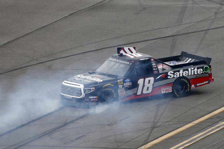 TALLADEGA, ALABAMA - OCTOBER 12: Harrison Burton, driver of the #18 Safelite AutoGlass Toyota, spins during the NASCAR Gander Outdoor Truck Series Sugarlands Shine 250 at Talladega Superspeedway on October 12, 2019 in Talladega, Alabama. (Photo by Brian Lawdermilk/Getty Images) | Getty Images