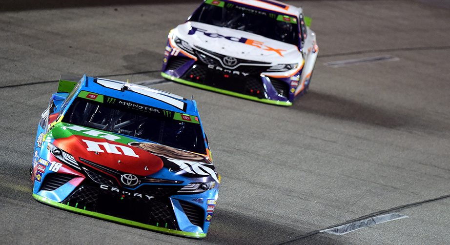RICHMOND, VIRGINIA - SEPTEMBER 21: Kyle Busch, driver of the #18 M&M's Hazelnut Toyota, leads Denny Hamlin, driver of the #11 FedEx Office Toyota, during the Monster Energy NASCAR Cup Series Federated Auto Parts 400 at Richmond Raceway on September 21, 2019 in Richmond, Virginia. (Photo by Jared C. Tilton/Getty Images) | Getty Images