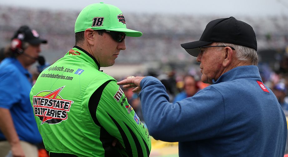 DOVER, DELAWARE - OCTOBER 06: Kyle Busch, driver of the #18 Interstate Batteries Toyota, talks with team owner, Joe Gibbs, prior to the start of the Monster Energy NASCAR Cup Series Drydene 400 at Dover International Speedway on October 06, 2019 in Dover, Delaware. (Photo by Matt Sullivan/Getty Images) | Getty Images