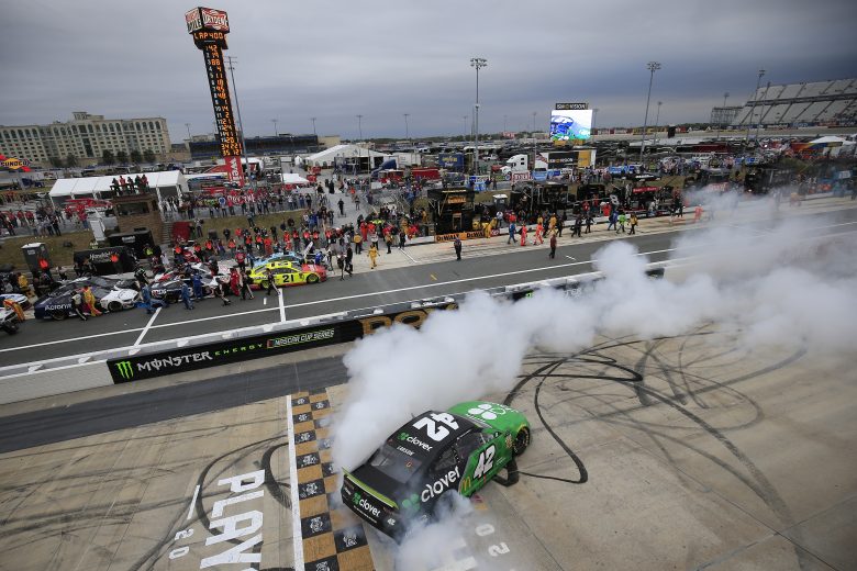 DOVER, DELAWARE - OCTOBER 06: Kyle Larson, driver of the #42 Clover Chevrolet, celebrates with a burnout after winning the Monster Energy NASCAR Cup Series Drydene 400 at Dover International Speedway on October 06, 2019 in Dover, Delaware. (Photo by Chris Trotman/Getty Images) | Getty Images