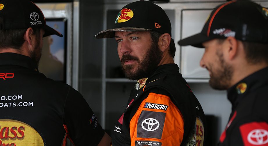 DOVER, DELAWARE - OCTOBER 04: Martin Truex Jr., driver of the #19 Bass Pro Shops Toyota, stands by his car during practice for the Monster Energy NASCAR Cup Series Drydene 400 at Dover International Speedway on October 04, 2019 in Dover, Delaware. (Photo by Matt Sullivan/Getty Images) | Getty Images