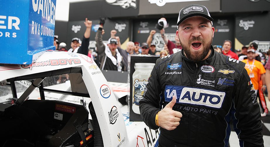 TALLADEGA, ALABAMA - OCTOBER 12: Spencer Boyd, driver of the #20 Alabama Roofing Professionals Chevrolet, celebrates in victory lane after winning the NASCAR Gander Outdoor Truck Series Sugarlands Shine 250 at Talladega Superspeedway on October 12, 2019 in Talladega, Alabama. (Photo by Chris Graythen/Getty Images) | Getty Images