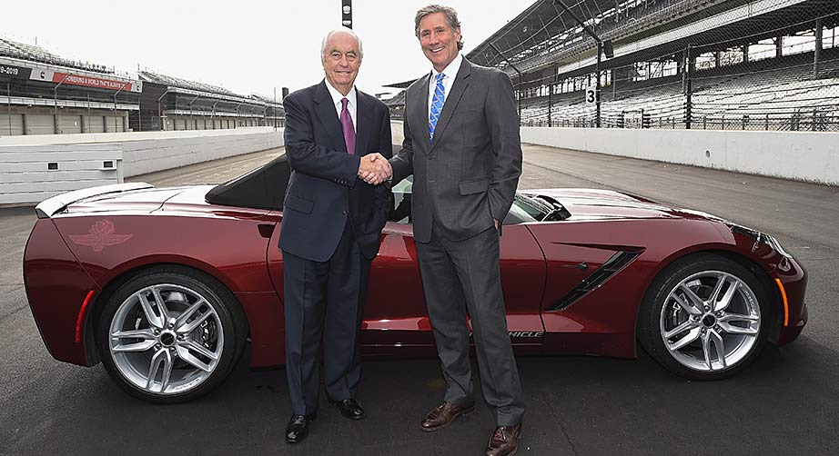 Roger Penske and Tony George shake hands on the frontstretch at Indianapolis Motor Speedway