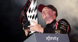 Tyler Reddick and the 2019 Xfinity Series championship trophy