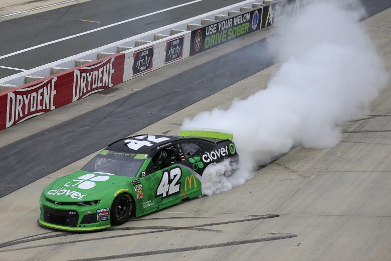 DOVER, DELAWARE - OCTOBER 06: Kyle Larson, driver of the #42 Clover Chevrolet, celebrates winning the Monster Energy NASCAR Cup Series Drydene 400 at Dover International Speedway on October 06, 2019 in Dover, Delaware. (Photo by Chris Trotman/Getty Images) | Getty Images