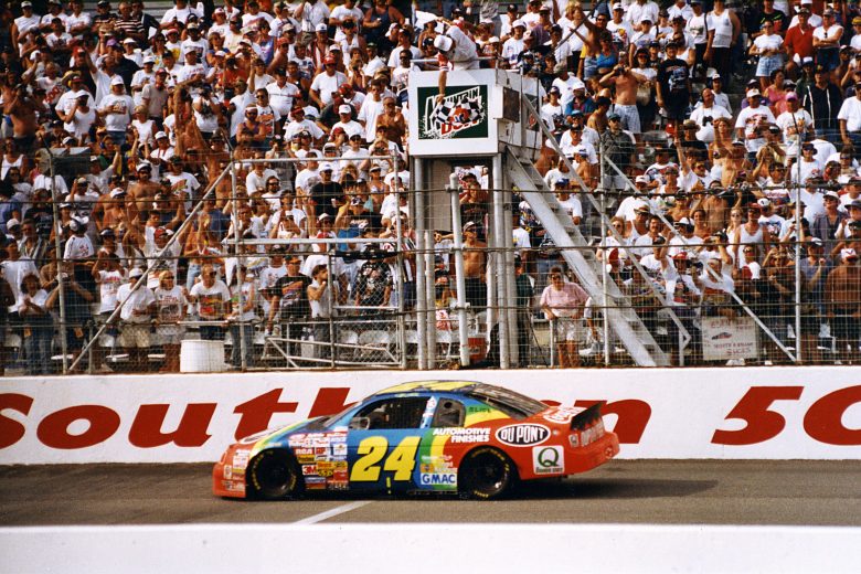 DARLINGTON, SC Ð 1990s: Jeff Gordon takes the checkered flag to win the Mountain Dew Southern 500 NASCAR Cup race at Darlington Raceway. Gordon won the race three consecutive years when Mountain Dew was the signature sponsor from 1995 through 1997. He won the Southern 500 for a fourth straight year in 1998 when the race was sponsored by Pepsi-Cola. (Photo by ISC Images & Archives via Getty Images)
