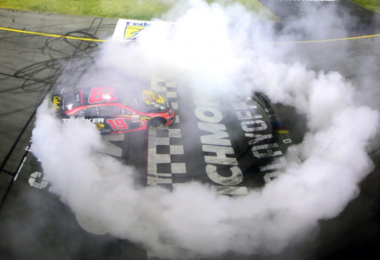 RICHMOND, VIRGINIA - SEPTEMBER 21: Martin Truex Jr., driver of the #19 Bass Pro Shops Toyota, celebrates with a burnout after winning the Monster Energy NASCAR Cup Series Federated Auto Parts 400 at Richmond Raceway on September 21, 2019 in Richmond, Virginia. (Photo by Jared C. Tilton/Getty Images) | Getty Images
