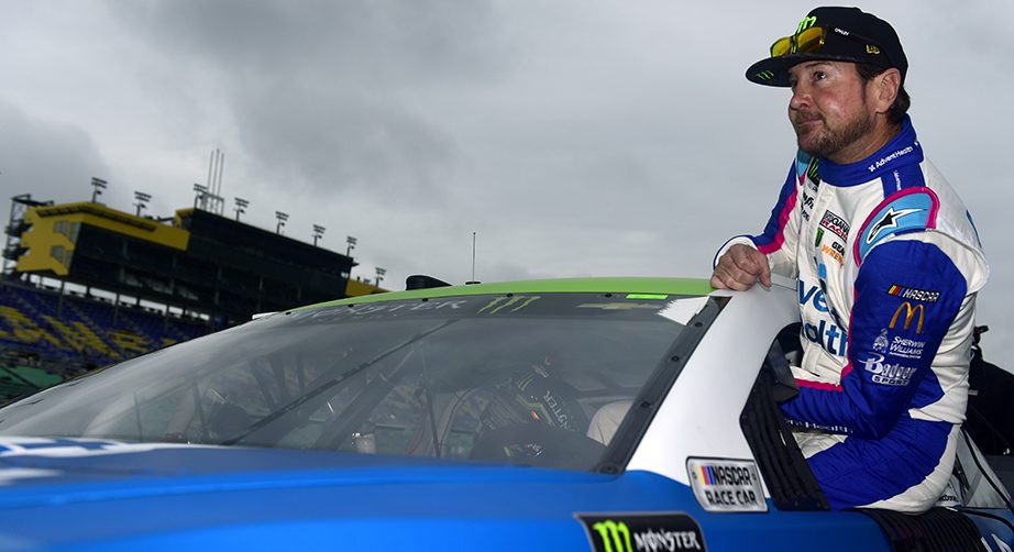 KANSAS CITY, KANSAS - OCTOBER 19: Kurt Busch, driver of the #1 Advent Health Chevrolet, climbs into his car during qualifying for the Monster Energy NASCAR Cup Series Hollywood Casino 400 at Kansas Speedway on October 19, 2019 in Kansas City, Kansas. (Photo by Jared C. Tilton/Getty Images) | Getty Images