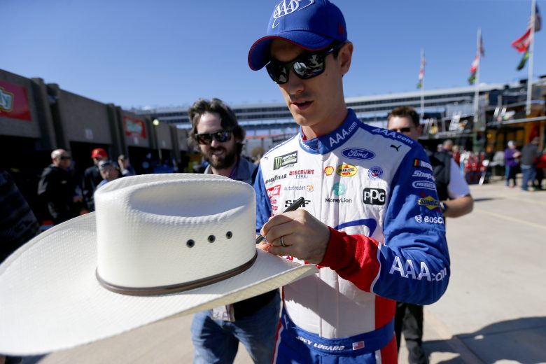 FORT WORTH, TEXAS - NOVEMBER 01: Joey Logano, driver of the #22 AAA Insurance Ford, signs autographs for fans during practice for the Monster Energy NASCAR Cup Series AAA Texas 500 at Texas Motor Speedway on November 01, 2019 in Fort Worth, Texas. (Photo by Jonathan Ferrey/Getty Images) | Getty Images
