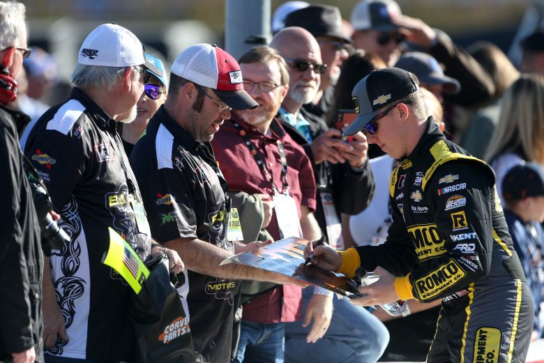 FORT WORTH, TEXAS - NOVEMBER 02: John Hunter Nemechek, driver of the #23 Romco Equipment Co. Chevrolet, signs autographs for fans during the Salute to Veterans Qualifying Day Fueled by The Texas Lottery for the NASCAR Xfinity Series O'Reilly Auto Parts 300 at Texas Motor Speedway on November 02, 2019 in Fort Worth, Texas. (Photo by Brian Lawdermilk/Getty Images) | Getty Images