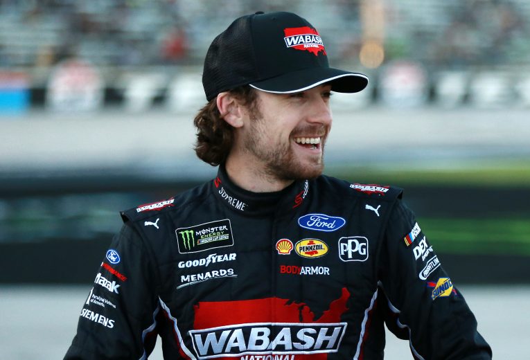 FORT WORTH, TEXAS - NOVEMBER 02: Ryan Blaney, driver of the #12 Wabash National Ford, stands on the grid during the Salute to Veterans Qualifying Day Fueled by The Texas Lottery for the Monster Energy NASCAR Cup Series AAA Texas 500 at Texas Motor Speedway on November 02, 2019 in Fort Worth, Texas. (Photo by Sean Gardner/Getty Images) | Getty Images