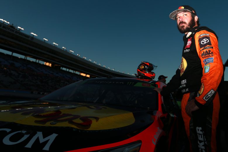 FORT WORTH, TEXAS - NOVEMBER 02: Martin Truex Jr., driver of the #19 Bass Pro Shops Toyota, stands on the grid during the Salute to Veterans Qualifying Day Fueled by The Texas Lottery for the Monster Energy NASCAR Cup Series AAA Texas 500 at Texas Motor Speedway on November 02, 2019 in Fort Worth, Texas. (Photo by Sean Gardner/Getty Images) | Getty Images