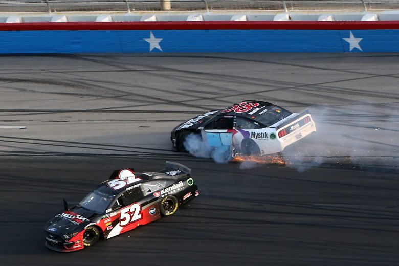 FORT WORTH, TEXAS - NOVEMBER 03: Garrett Smithley, driver of the #52 Victory Lane/Kendall Oil Ford, and David Ragan, driver of the #38 Mystik Lubricants Ford, are involved in an on-track incident during the Monster Energy NASCAR Cup Series AAA Texas 500 at Texas Motor Speedway on November 03, 2019 in Fort Worth, Texas. (Photo by Brian Lawdermilk/Getty Images) | Getty Images