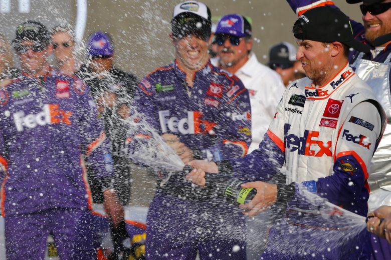 AVONDALE, ARIZONA - NOVEMBER 10: Denny Hamlin, driver of the #11 FedEx Ground Toyota, celebrates in Victory Lane after winning the Monster Energy NASCAR Cup Series Bluegreen Vacations 500 at ISM Raceway on November 10, 2019 in Avondale, Arizona. (Photo by Jonathan Ferrey/Getty Images) | Getty Images