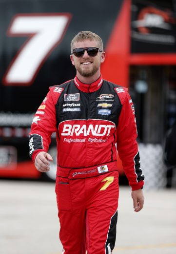 HOMESTEAD, FLORIDA - NOVEMBER 15: Justin Allgaier, driver of the #7 BRANDT Professional Agriculture Chevrolet, walks through the garage area during practice for the NASCAR Xfinity Series Ford EcoBoost 300 at Homestead-Miami Speedway on November 15, 2019 in Homestead, Florida. (Photo by Brian Lawdermilk/Getty Images) | Getty Images