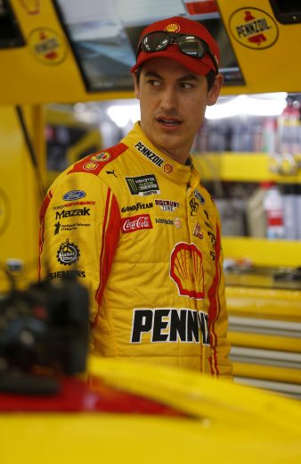 HOMESTEAD, FLORIDA - NOVEMBER 15: Joey Logano, driver of the #22 AAA Insurance Ford, stands in the garage area during practice for the Monster Energy NASCAR Cup Series Ford EcoBoost 400 at Homestead-Miami Speedway on November 15, 2019 in Homestead, Florida. (Photo by Brian Lawdermilk/Getty Images) | Getty Images