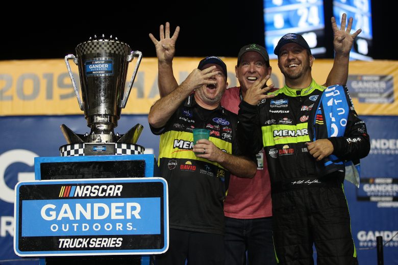 HOMESTEAD, FLORIDA - NOVEMBER 15: Matt Crafton, driver of the #88 Jack Links/Menards Ford, celebrates with Ron Honaday Jr. after winning the NASCAR Gander Outdoors Truck Series Ford Championship at Homestead-Miami Speedway on November 15, 2019 in Homestead, Florida. (Photo by Chris Graythen/Getty Images) | Getty Images