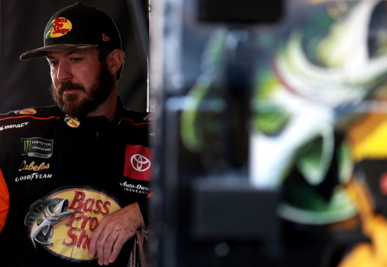 HOMESTEAD, FLORIDA - NOVEMBER 16: Martin Truex Jr., driver of the #19 Bass Pro Shops Toyota, stands in the garage during practice for the Monster Energy NASCAR Cup Series Ford EcoBoost 400 at Homestead-Miami Speedway on November 16, 2019 in Homestead, Florida. (Photo by Sean Gardner/Getty Images) | Getty Images